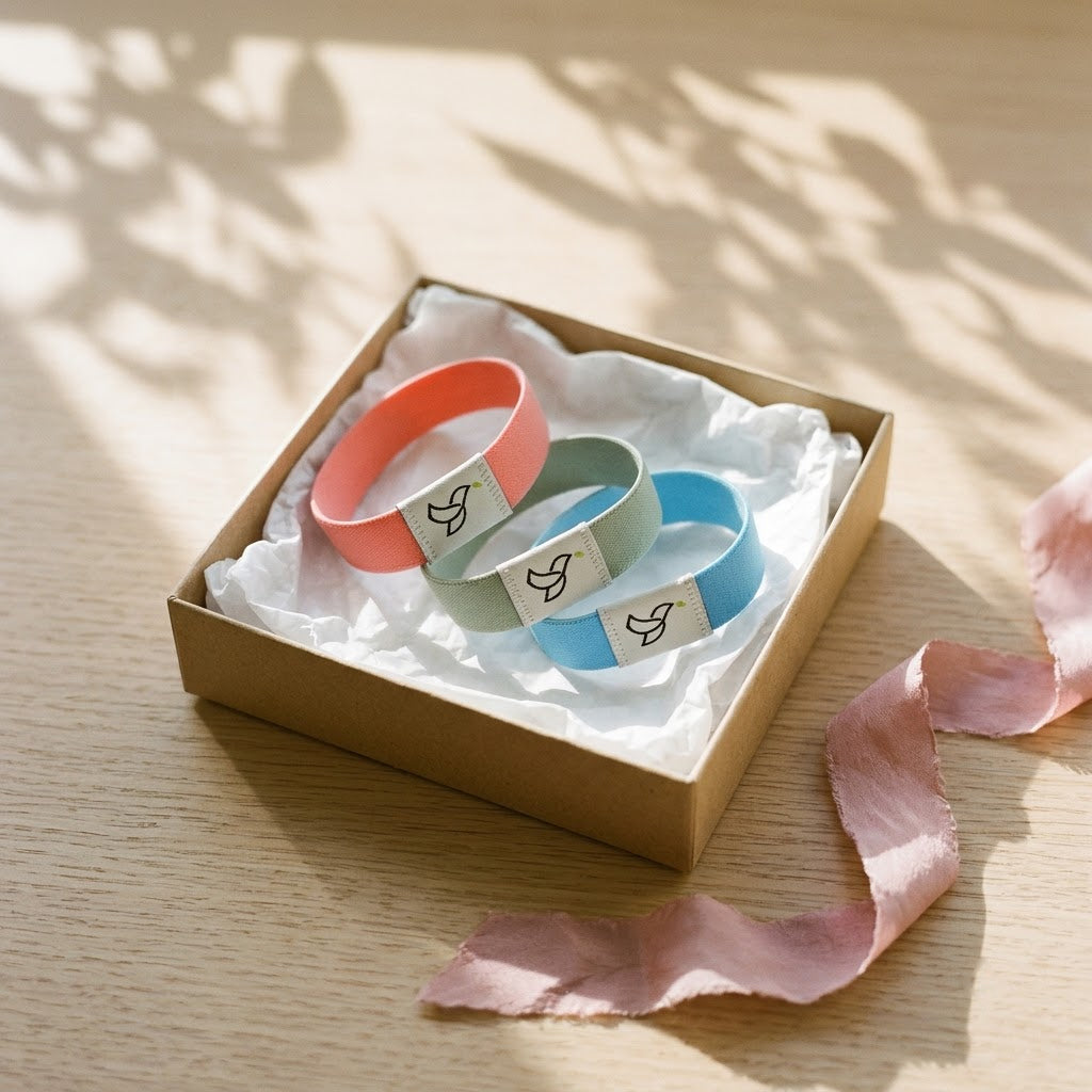 Three bracelets in coral, sage and sky blue in a gift box