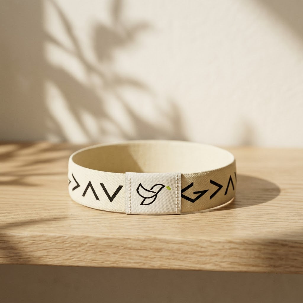 Cream Daily Verse Bracelet with dove tag on an oak shelf