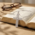 Radiant Pavé Cross Necklace, held in prayer